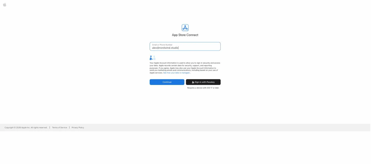 The App Store Connect sign-in page with the email field filled and the cursor moving to Continue